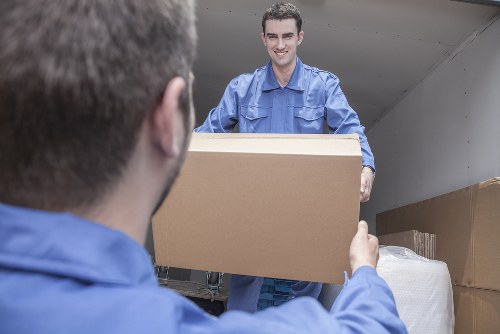 Careful loading of sofas and tables for a local move in North London