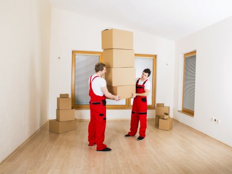 Office furniture and equipment being prepared for transport